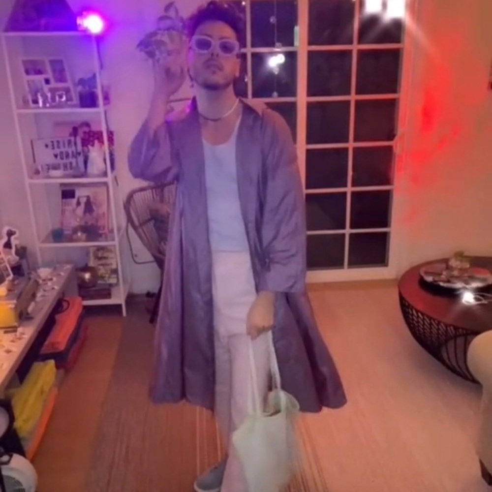 Purple raincoat by The Totes coat
